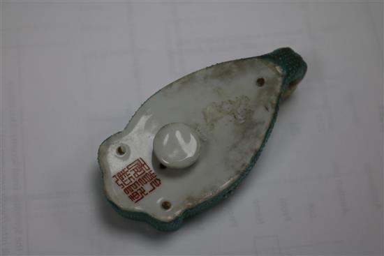 A 19th Century Chinese enamelled porcelain belt hook, pseudo Qianlong mark